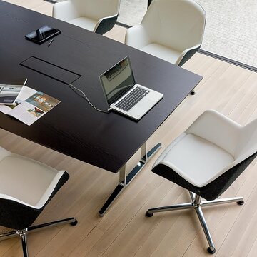 skill conference table Dark conference table with cable management.