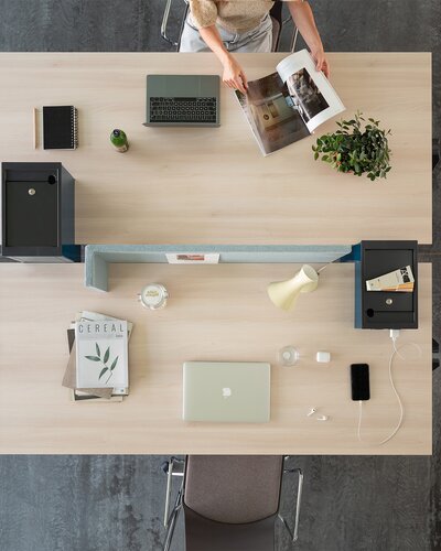 Two office desks photographed from above.