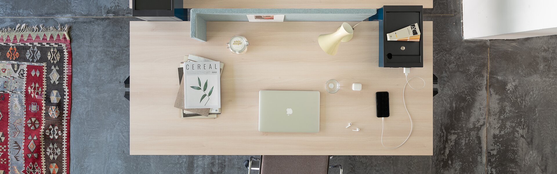 Two office desks photographed from above.