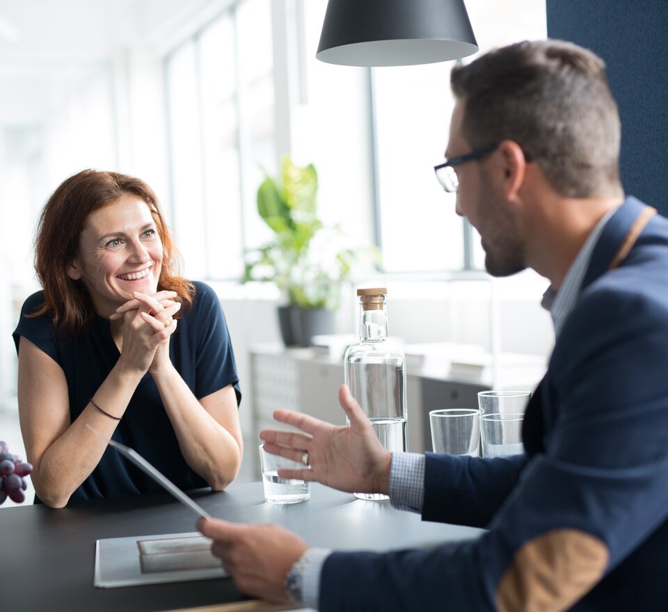 m.zone cloud Two people sitting at a table.