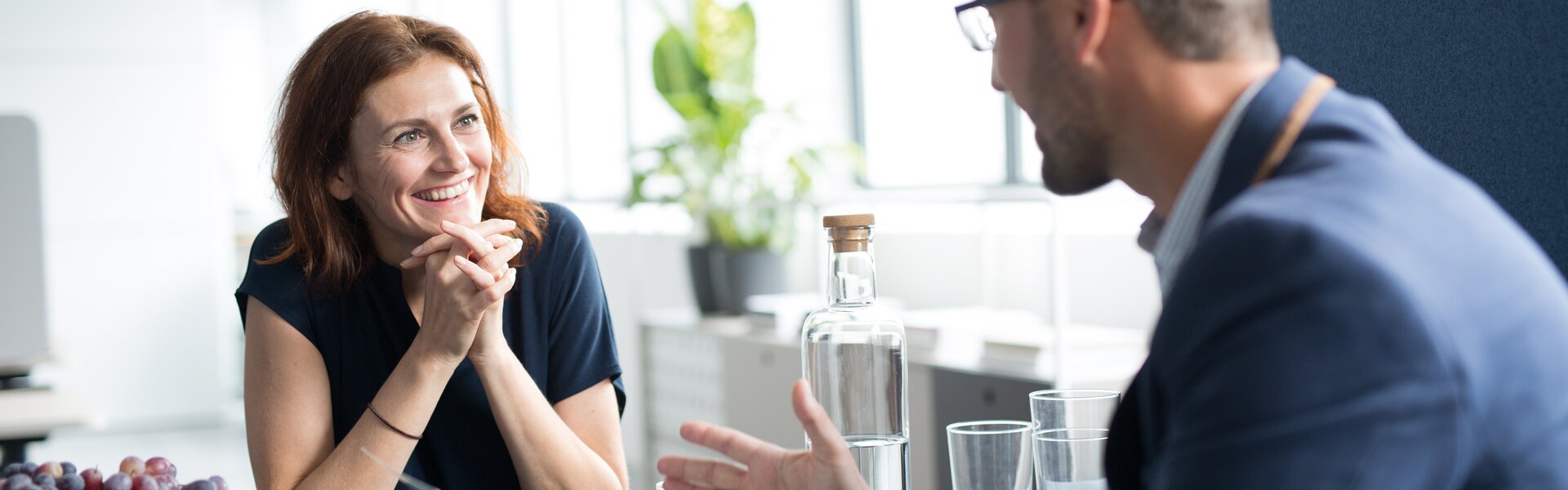m.zone cloud Two people sitting at a table.
