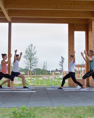 People do yoga in the Activity Garden.