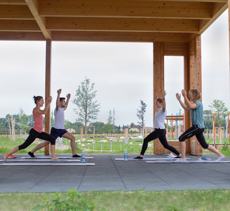 People do yoga in the Activity Garden.